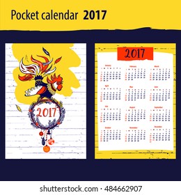 Calendar for year 2017 with vector silhouette cock and christmas decoration on color background. Design Illustration vector calendar with symbol year red rooster 2017.