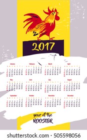 Calendar for year 2017 with vector silhouette cock on color background. Design Illustration vector calendar with symbol year red rooster 2017.