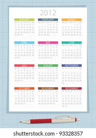 calender for 2012 on graph paper background, with pen
