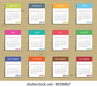 calender for 2012 in square design on wood background