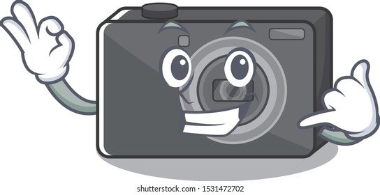 Call me digital camera on a cartoon table