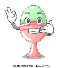 Call me in egg cup isolated on character
