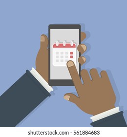 Callendar in smartphone. Man holds phone with callendar on the screen. Concept of agenda and reminder.