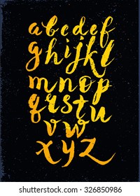 Calligraphic alphabet, font, black  background. Letters written with a brush or chalk.