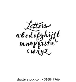 Calligraphic alphabet, font, black and white background. Letters written with a brush or chalk.