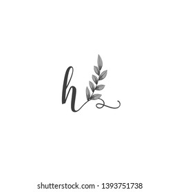 Calligraphic letter H with leaf.Hand drawn uppercase letter with natural element.Vector icon.Initial logo isolated on light background.