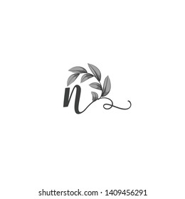 Calligraphic letter N with leaf.Hand drawn lowercase letter with natural element.Vector icon.Initial logo isolated on light background. 