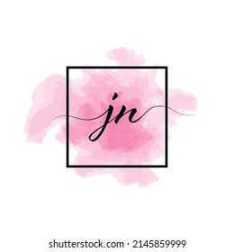 Calligraphic lowercase letters J and N are written in a solid line on a colored background in a frame.