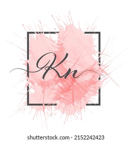 Calligraphic lowercase letters K and N are written in a solid line on a colored background in a frame.