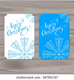 Calligraphic Merry Christmas lettering on  background with snowflakes. Vector illustration.Creative design element for a Christmas card.