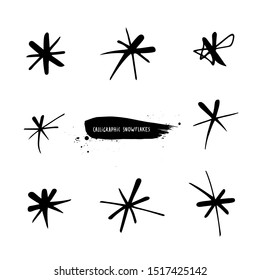Calligraphic snowflakes set. Black and white hand drawn snow for winter design