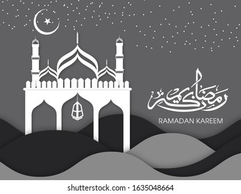 Calligraphic text of Ramadan Kareem translated in Arabic language with lamp and Mosque to celebrate Muslim community festival.