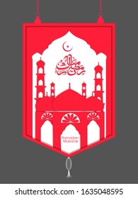 Calligraphic text of Ramadan Mubarak translated in Arabic language with Mosque to celebrate Muslim community festival.