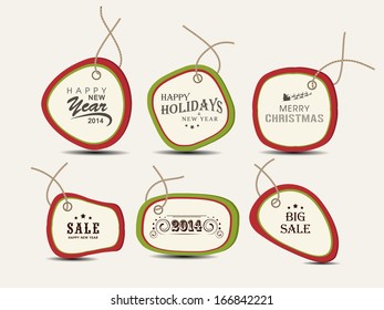 Calligraphic and typographic elements, frames, vintage labels, stickers, or tags for Merry Christmas and Happy New Year 2014 celebrations. 