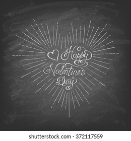 Calligraphic Valentine's headline in the form of heart on the blackboard. Hand drawn elements. Vector illustration.