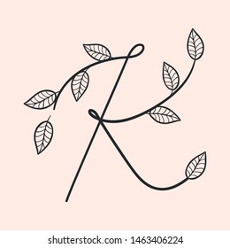 Calligraphy alphabet. Decorative handwritten font. Vector letter K decorated with leaves, florals. Wedding calligraphy. ABC for your design. Floral lettering. Monogram, Logo Branding