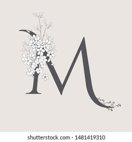Calligraphy alphabet. Decorative script font. Vector letter M decorated with leaves, florals. Wedding calligraphy. ABC for your design. Floral lettering. Monogram, Logo Branding