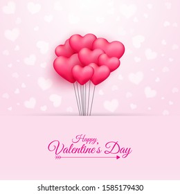 Calligraphy Happy Valentine's Day Text and Bunch of Pink Heart Shaped Balloons on Pink Background.