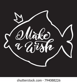 Calligraphy make a wish phrase in fish shape outline. Vector handwritten lettering.