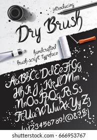 Calligraphy mockup with dry brush typeface, pen and paint tube on the background of black sheet of paper and grunge table