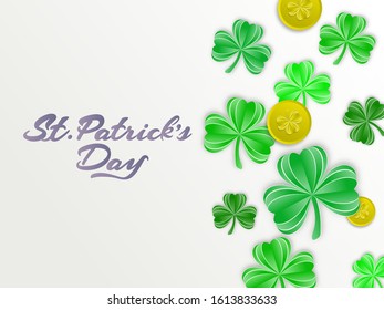 Calligraphy St. Patrick's Day Text with Green Paper Cut Shamrock Leaves and Coins Decorated on White Background.