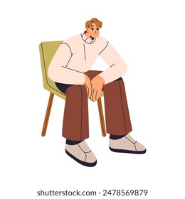 Calm young man sits on soft chair and leans on knees with hands. Person relaxes on comfortable seat during waiting. Character rests at leisure. Flat isolated vector illustration on white background