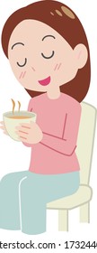 Eine beruhigende Frau trinkt Tee.