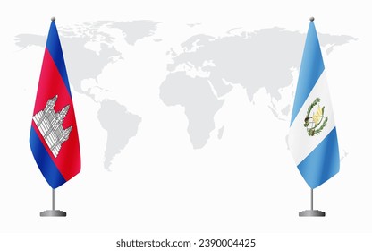 Cambodia and Guatemala flags for official meeting against background of world map.