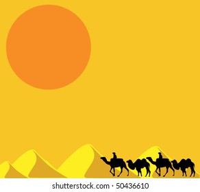 Camel caravan going through the sand dunes