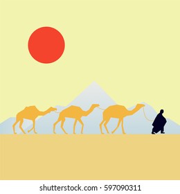 Camels caravan in the desert with mountains