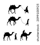 Camels and desert man silhouette walking