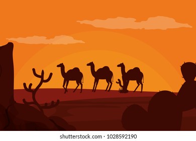 Camels walking on desert silhouette