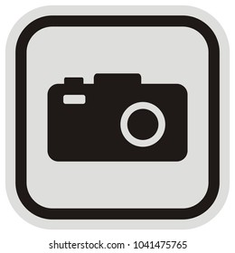 Camera at black and gray frame. Black silhouette of photo equipment, vector icon. Square button. Single object.