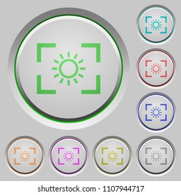 Camera brightness setting color icons on sunk push buttons