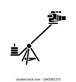 Camera crane black glyph icon. Shoot reportage in studio. Professional television shooting. Heavy weight equipment for filmmaking. Silhouette symbol on white space. Vector isolated illustration