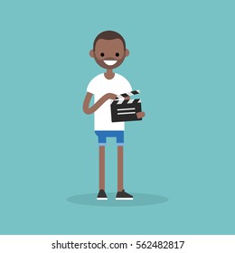 Camera crew: young black assistant holding a clapperboard / editable flat vector cartoon illustration, clip art