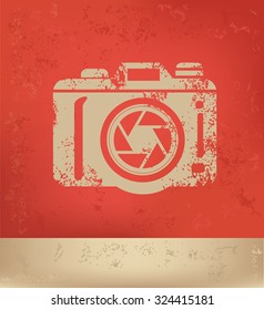 Camera design on red background, grunge vector