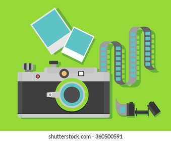 Camera with film with the film reel on a green background. Objects isolated on background. Flat vector illustration.