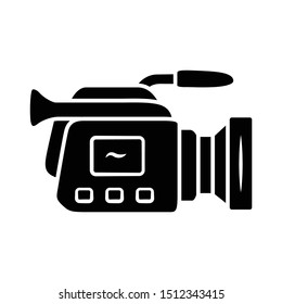 Camera glyph icon. Camcorder. Videotaping, video recording. Filmmaking professional equipment. Video production, cinematography industry. Silhouette symbol. Negative space Vector isolated illustration