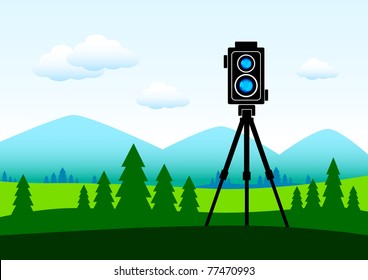 Camera in green landscape