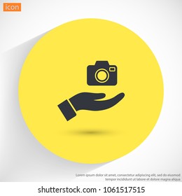 Camera in hand icon