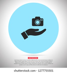 Camera in hand icon