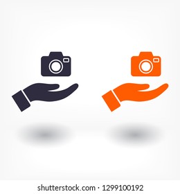 Camera in hand icon