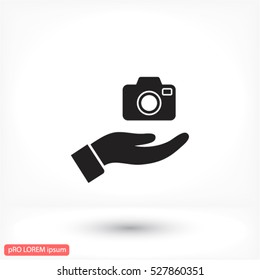 Camera in hand icon