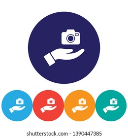 Camera in hand icon , lorem ipsum Flat design