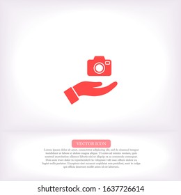 Camera in hand icon , lorem ipsum Flat design