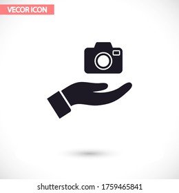 Camera in hand icon , lorem ipsum Flat design