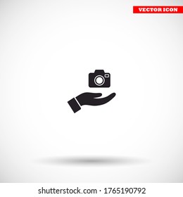 Camera in hand icon , lorem ipsum Flat design