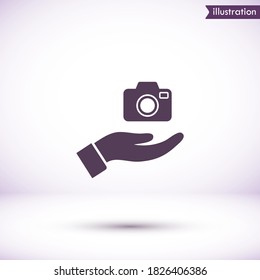 Camera in hand icon , lorem ipsum Flat design