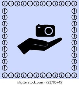 Camera in the hand icon, photo vector illustration